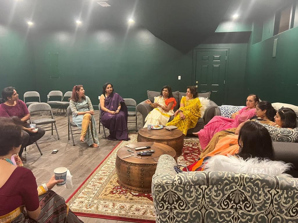 Women together at a Purple Wings community gathering